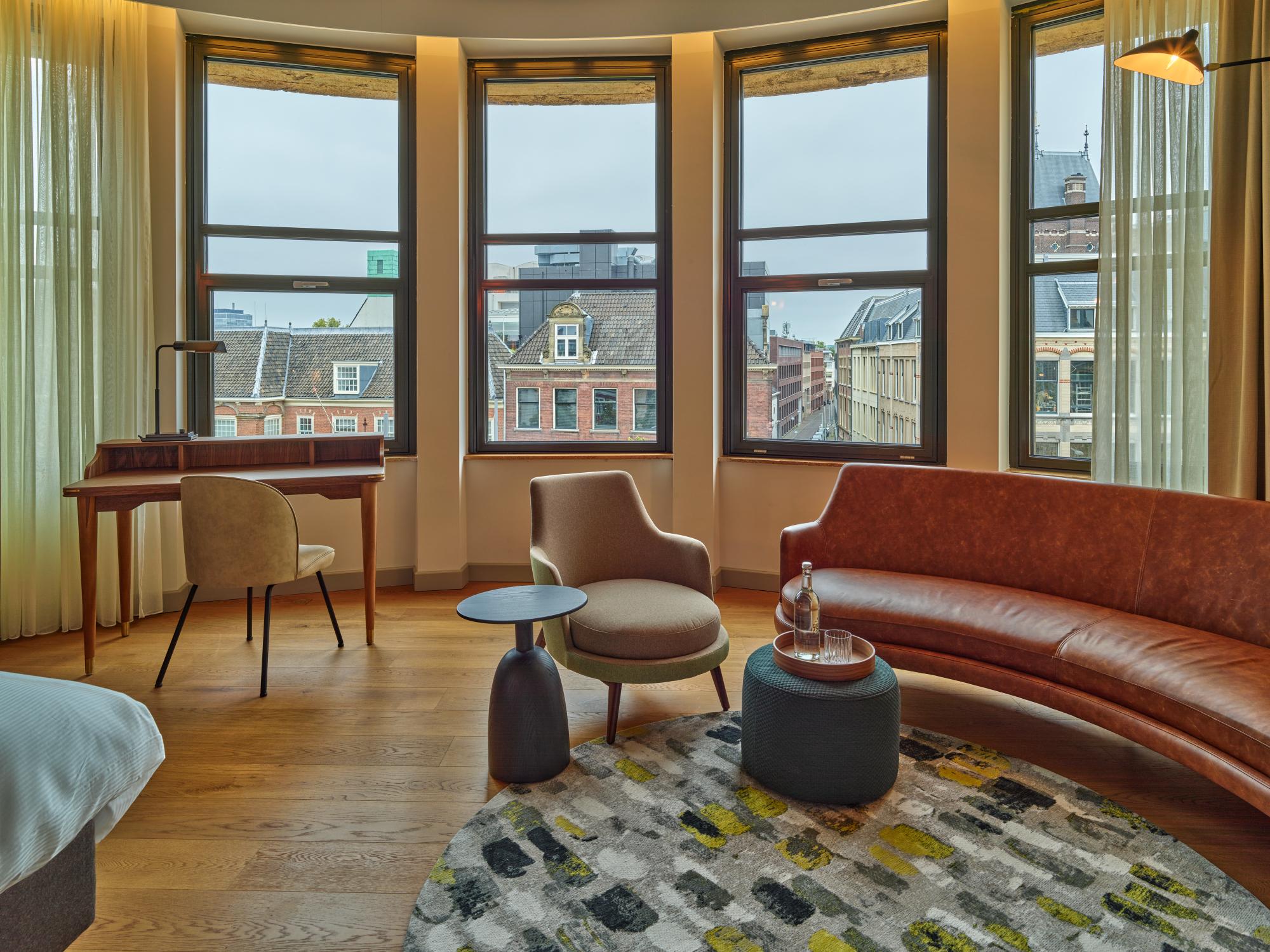 Natural light through large window overlooking The Hague from King Suite lounge