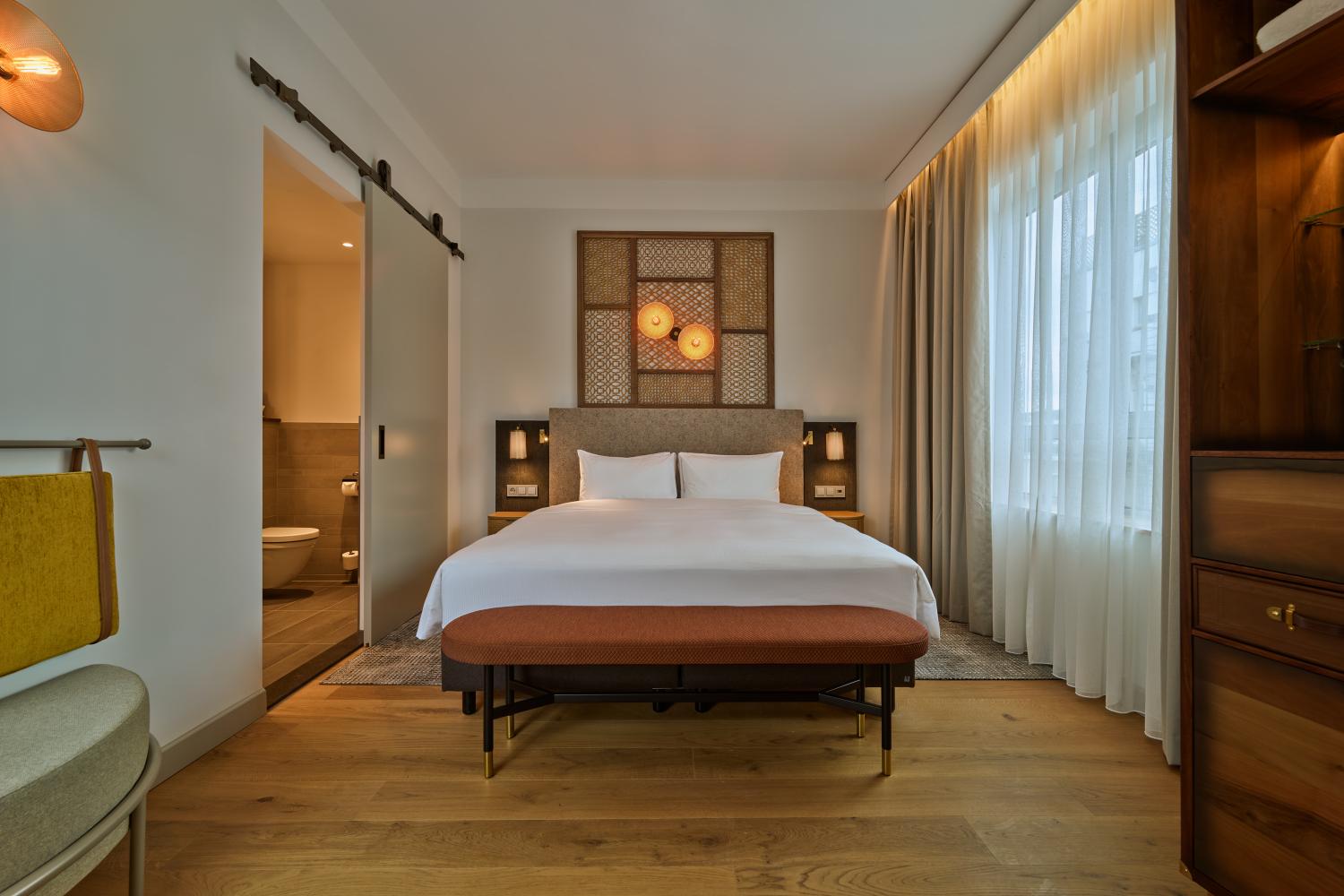 Spacious King Bed Suite with lounge area and sofa bed at voco The Hague