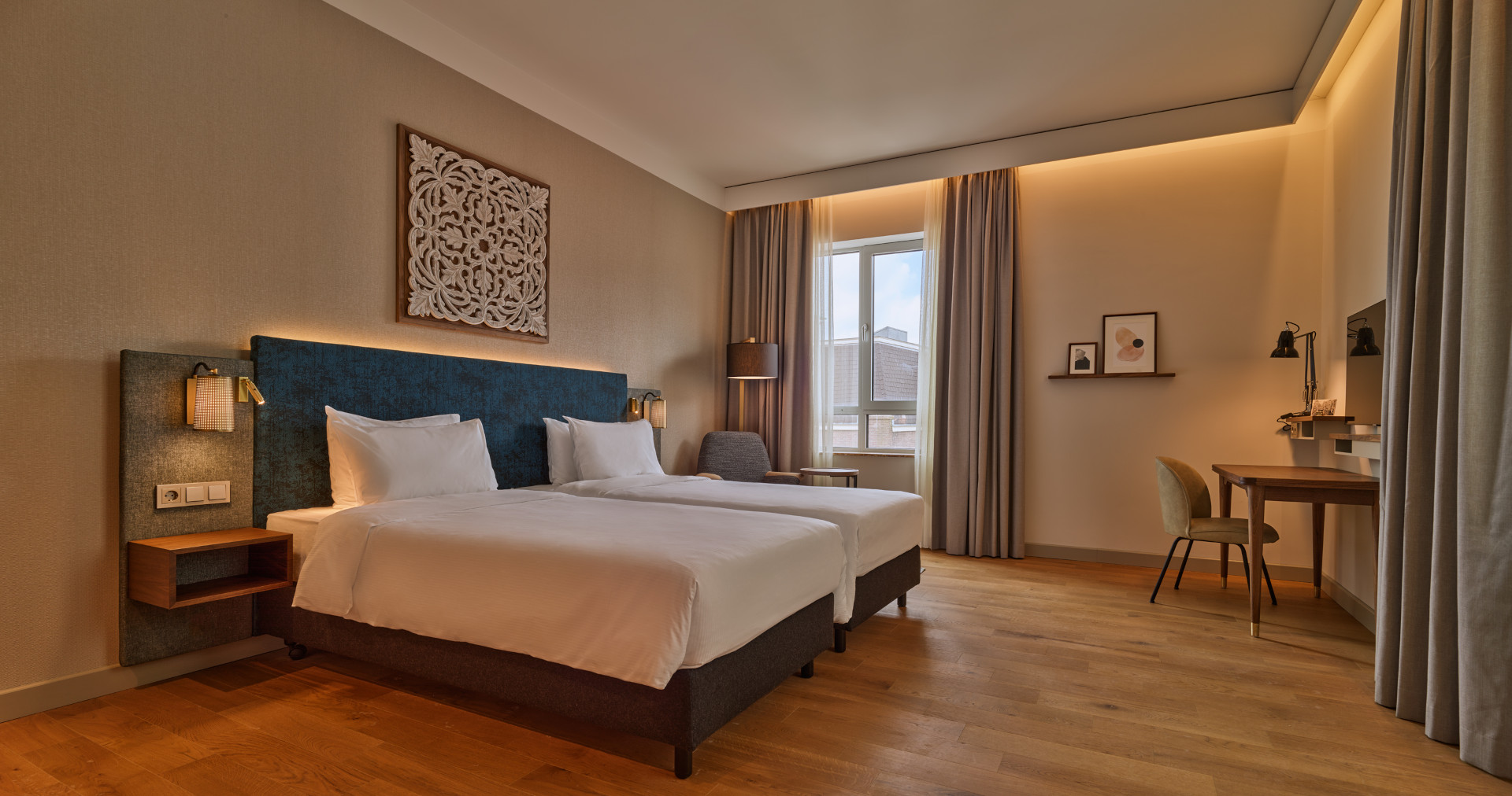 Spacious accessible room with twin beds and step-free layout at voco The Hague