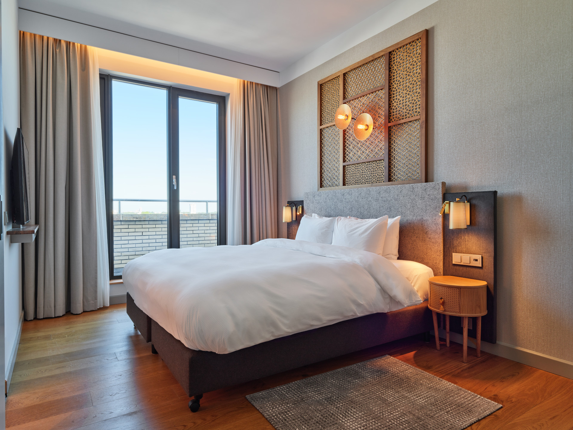 Spacious King Suite at voco The Hague with modern desig and natural daylight