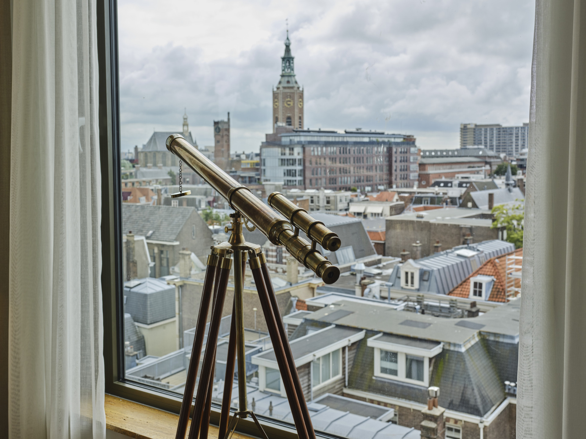 City view over The Hague from the King Suite at voco – high-floor room with large windows