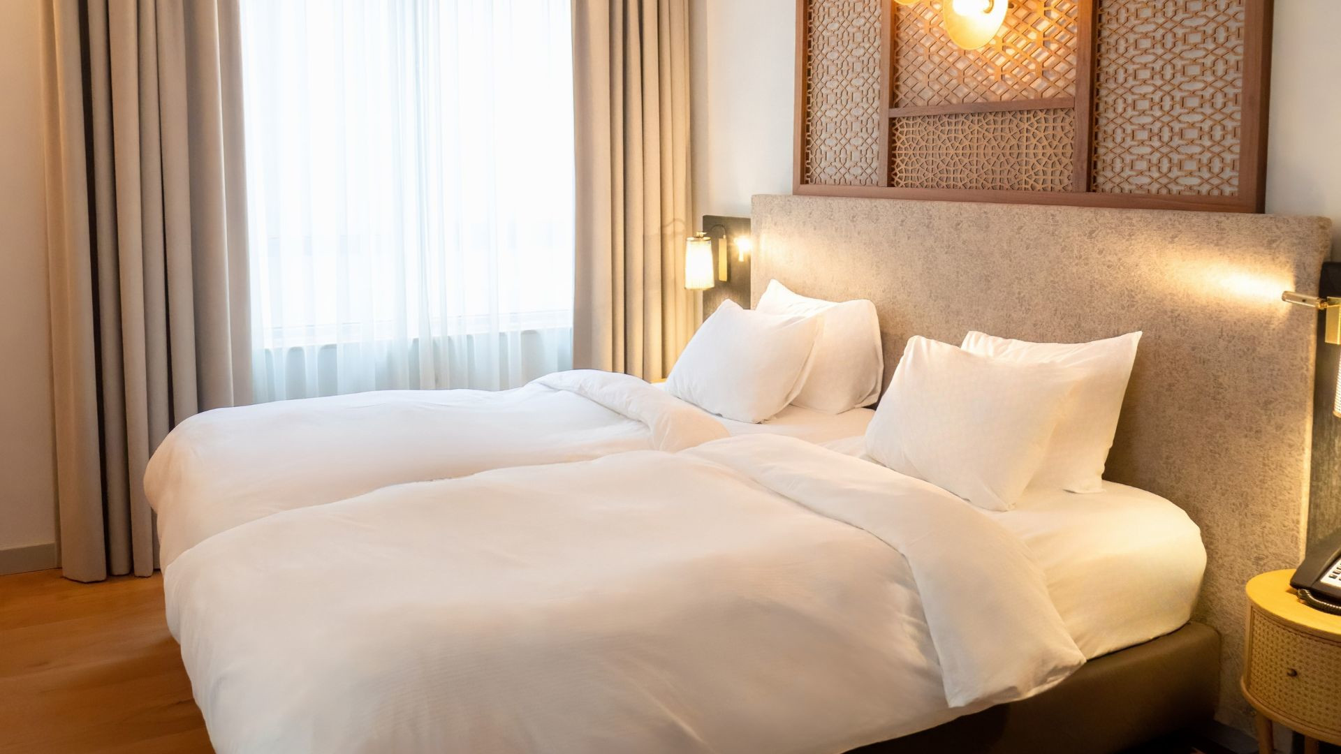 Comfortable Twin Premium room with city views and full amenities at voco The Hague.