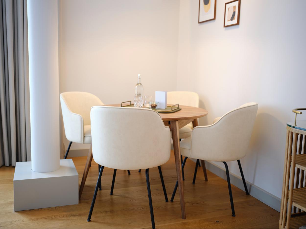 Private meeting space inside the King Suite at voco The Hague with natural daylight
