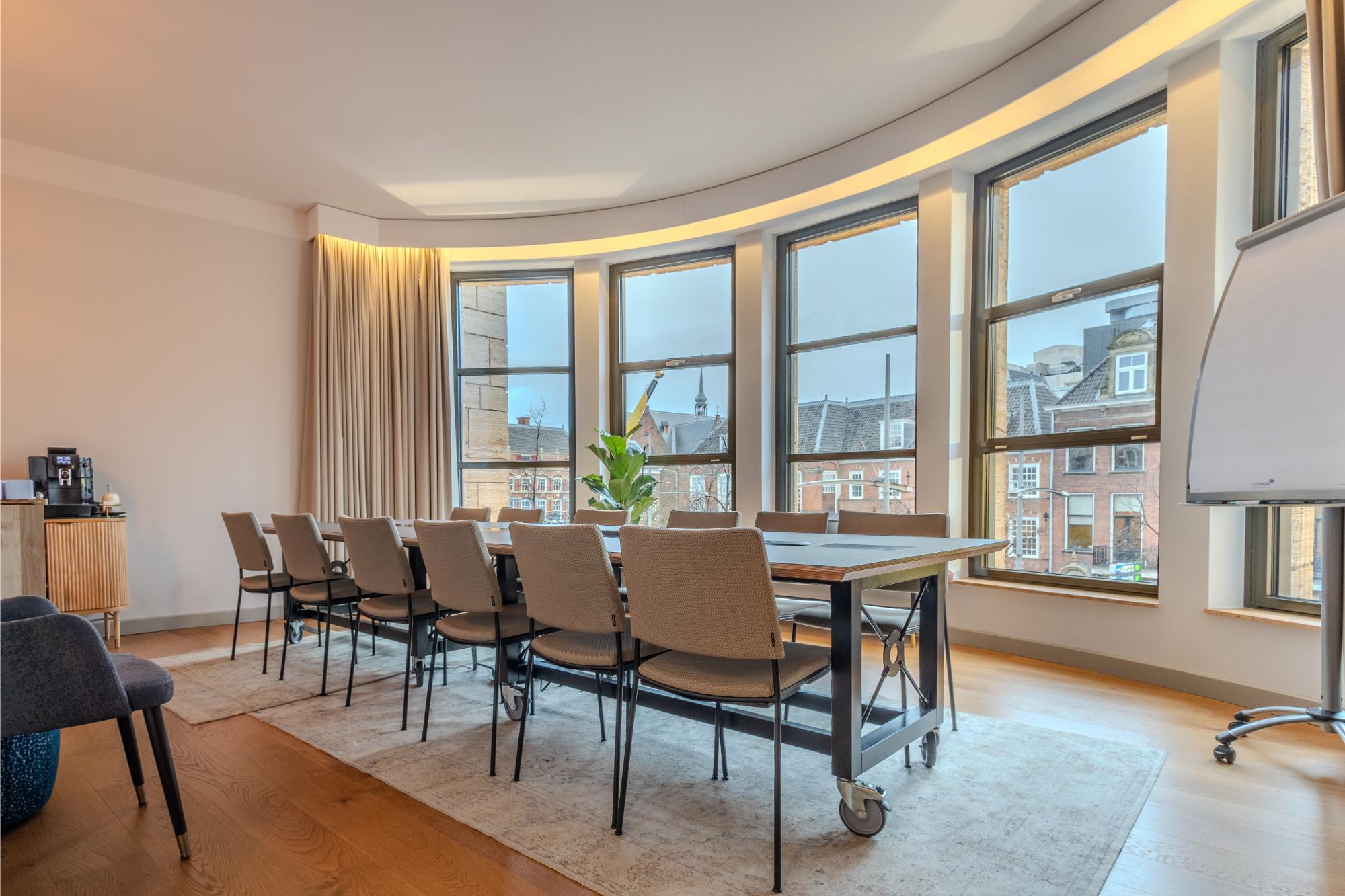 Panoramic windows with historic city view from voco The Hague Kneuterdijk boardroom