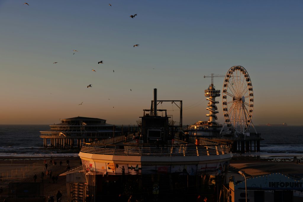 Orange sunset over The Hague skyline during King’s Day, a relaxed alternative to the busy Amsterdam celebrations.